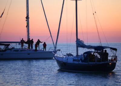 Photo of sailboats at sunset