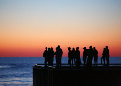 Photo of people watching a sunset