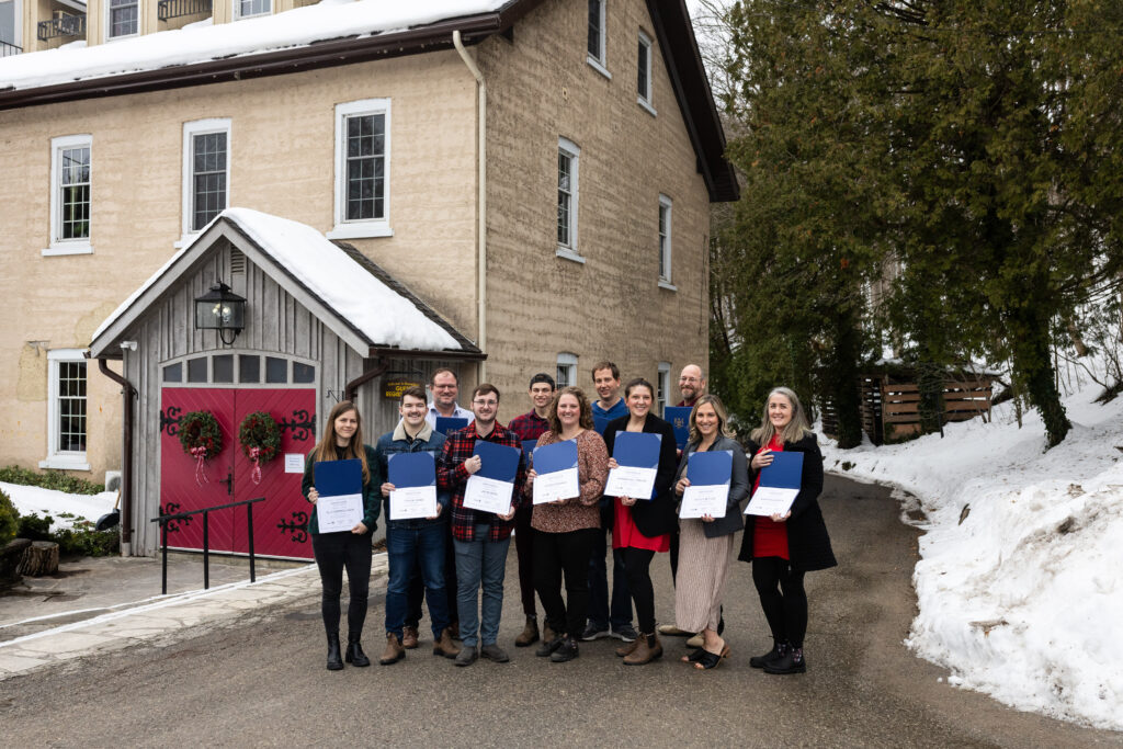 A group of individuals holding certificates received from Starter Company Plus Program