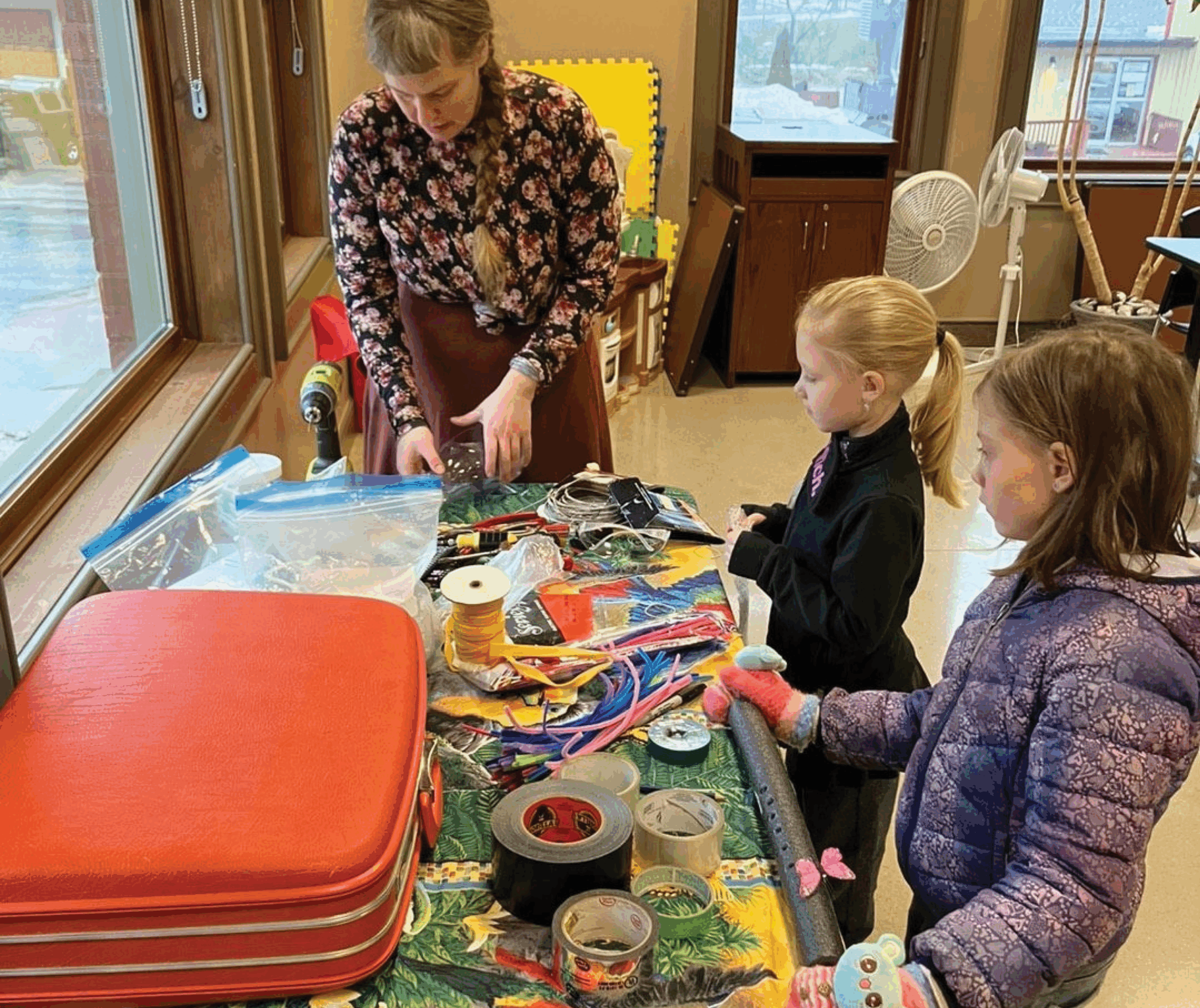 Image of Trash Theatre leader with two kids participating in workshop
